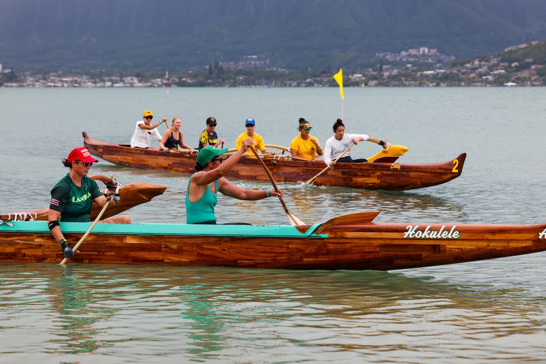 Race participants compete in a canoe race during the 2024 John D. Kaupiko Canoe Regatta at Marine Corps Base Hawaii, July 14, 2024. Eighteen canoe clubs across Oahu competed in 45 divisions, paddling through Kaneohe Bay for first place. MCBH hosted the canoe regatta in conjunction with the Hui Nalu Canoe Club as an opportunity to foster relations between the base and the local community. (U.S. Marine Corps photo by Lance Cpl. Carlos Daniel Chavez-Flores)