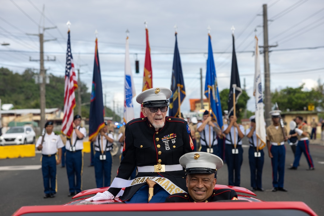 Marine corporal and WWII veteran Frank S. Wright (center) participates in the 80th Guam Liberation Day parade in Hagåtña, Guam, July 21, 2024. The parade is a celebration of U.S. forces liberating Guam from Japanese Imperial Forces in 1944 during World War II. Throughout the month of July there are events and ceremonies held as part of Guam’s liberation month. (U.S. Marine Corps photo by Lance Cpl. Ryan Little)