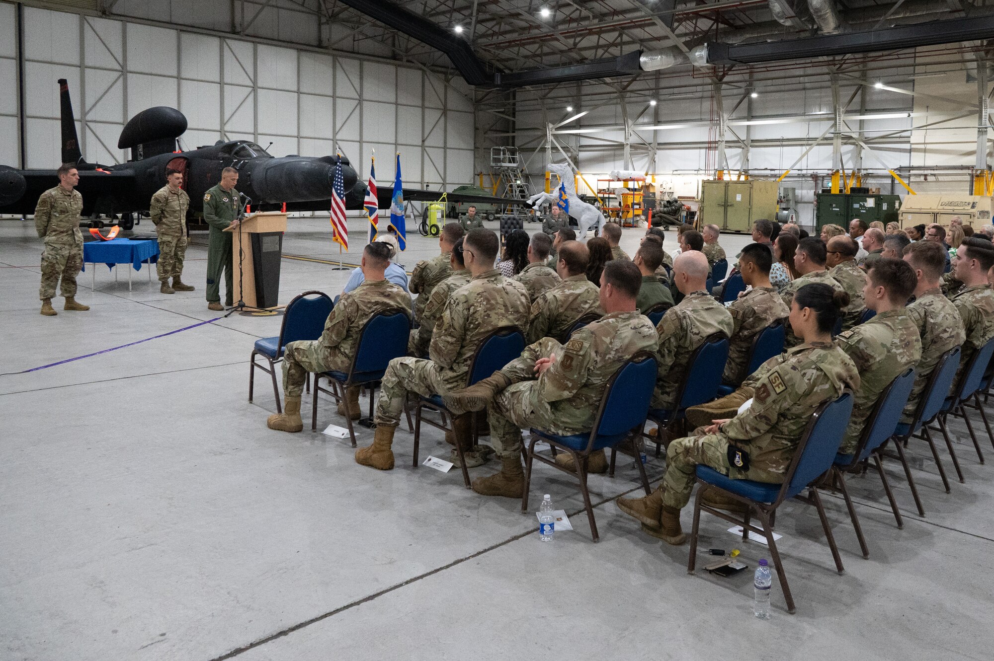 U.S. Air Force Lt. Col. Jonathan D. Young, 99th Expeditionary Reconnaissance Squadron outgoing commander gives a speech during a change of command ceremony.
