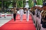 Chief of Naval Operations Adm. Lisa Franchetti salutes during a welcome honors ceremony prior to meeting with with Chief of Staff of the Armed Forces of the Philippines Gen. Romeo S. Brawner Jr., in Manila, July 26, 2024.