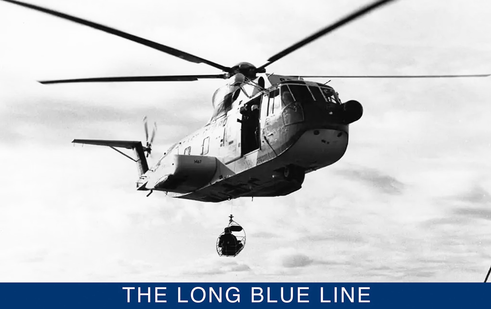 A vintage photo of a Coast Guard HH-3F “Pelican” making a hoist at sea. (Courtesy of the U.S. Coast Guard Aviation association)