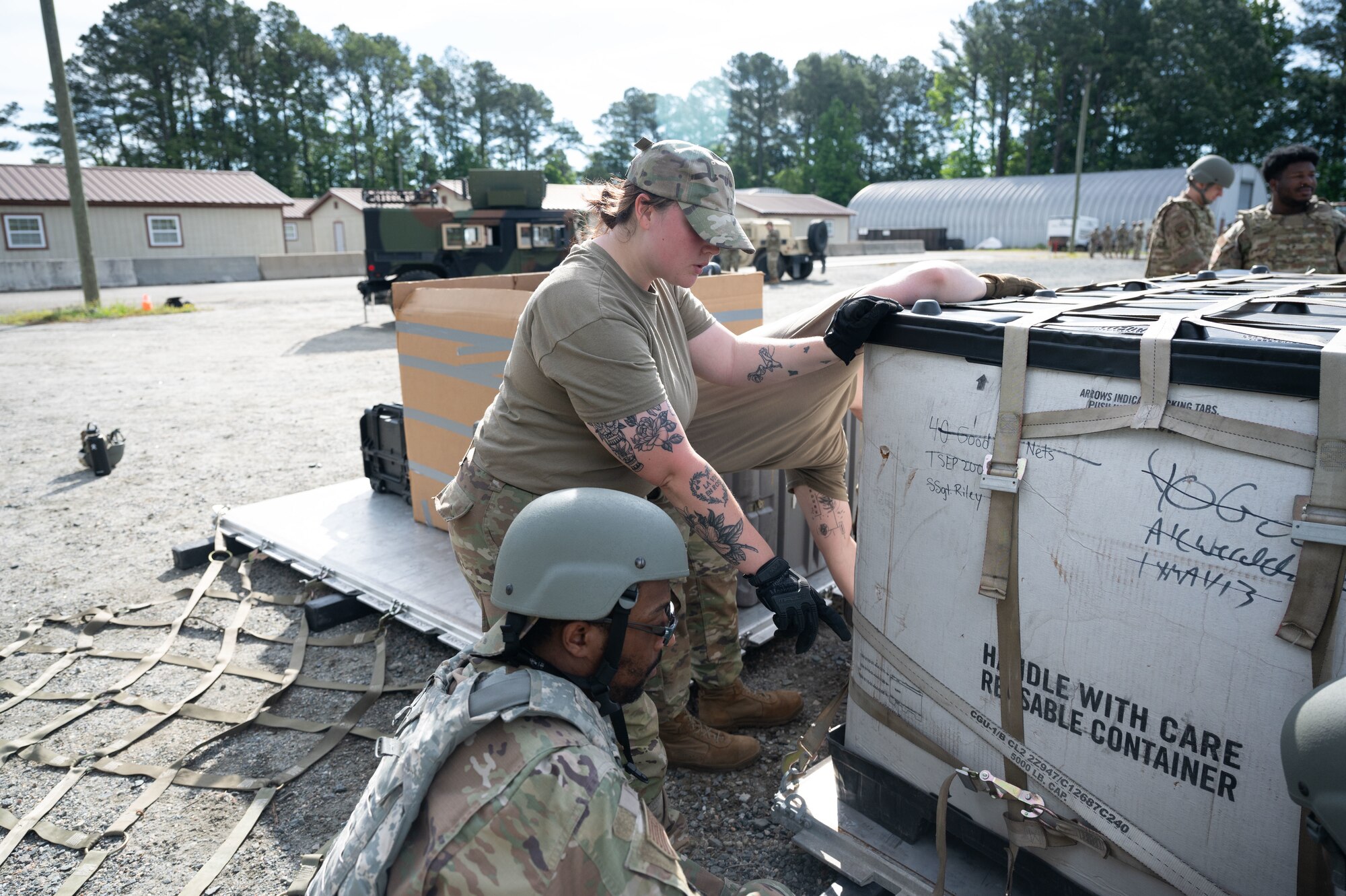 Airman teaches others how to secure cargo before moving them