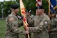 U.S. Army Col. Bryan Dunker, U.S. Army Support Activity Fort Dix inbound commander, passes to guidon to Command Sgt. Maj. James Van Zlike, USASA Fort Dix command sergeant major, during a change of command ceremony at Joint Base McGuire-Dix-Lakehurst, N.J., July 25, 2024. Prior to his current position, Dunker served as the executive officer for U.S. Northern Command’s deputy director. (U.S. Air Force photo by Airman 1st Class Aidan Thompson)