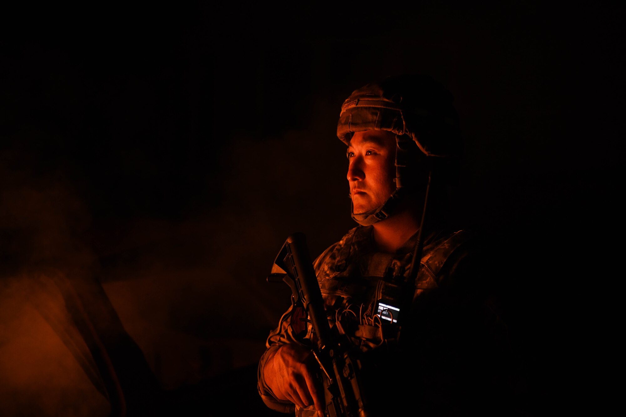 U.S. Air Force Tech. Sgt. Danny Lee, a fire protection specialist assigned to the 178th Fire Protection Squadron, searches for hostile combatants on Muscatatuck Urban Training Center, Indiana, June 20, 2024. Members of the 178th Civil Engineering participated in capturing simulated enemy territory involving explosives and hostile resistance. (U.S. Air National Guard photo by Airman 1st Class Josh Kaeser)
