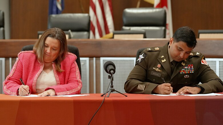 City Manager Mary Bunting (left) and U.S. Army Corps of Engineers (USACE) Norfolk District Commander Col. Sonny Avichal (right) signed an agreement to initiate a regional study of coastal storm risks and the solutions they will require on 26 July, 2024.  USACE received $3 million in federal appropriations to fund the study through the Disaster Relief Act of 2019.