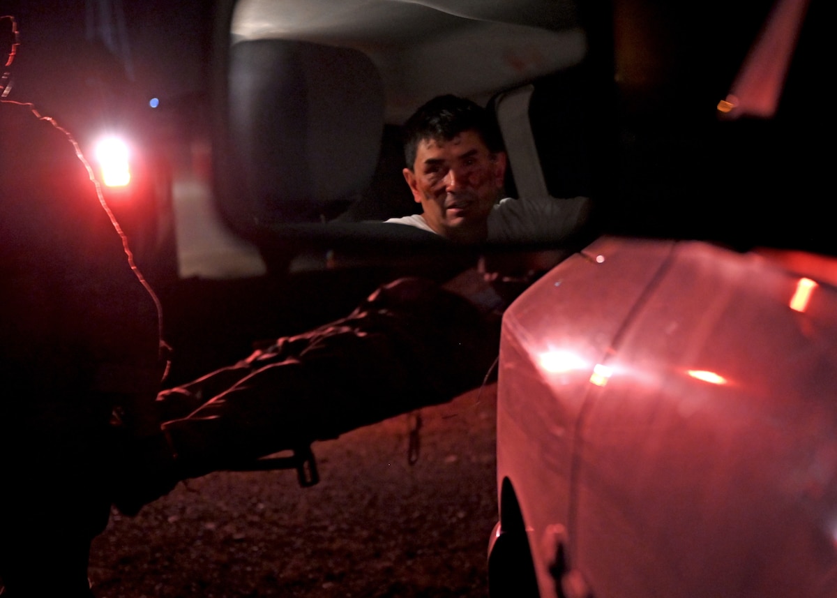 A simulated patient was rescued during a training scenario conducted by the 48th Rescue Squadron at the Barry M. Goldwater Range, Gila Bend, Ariz., July 19, 2024. The training scenario was a simulated mass shooting where 11 people were injured. The participating Special Warfare Team-3’s mission was to end the mass shooting, provide patient care and medically evacuate injured personnel. (U.S. Air Force photo by Staff Sgt. Abbey Rieves)