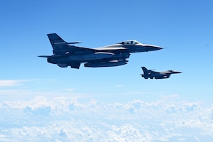 Two F-16 Fighting Falcon fighter jets assigned to the South Carolina Air National Guard’s 169th Fighting Wing soar above St. Croix, U.S. Virgin Islands, during exercise Caribbean Fox July 22, 2024. Caribbean Fox provides a dynamic training experience for the warfighter to maintain readiness to integrate, operate and dominate air superiority across the full spectrum of conflict.