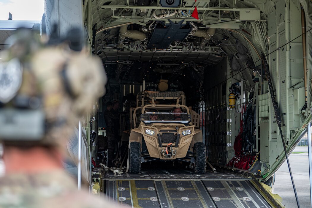 U.S. Air Force Airmen assigned to 38th Rescue Squadron sit in their off-road vehicle inside an HC-130J Combat King II at Moody Air Force Base, Georgia, July 24, 2024. Pararescuemen are members of Air Force special warfare and are the only Department of Defense elite combat force specifically organized, trained, equipped, and postured to conduct combat rescue operations. (U.S. Air Force photo by Senior Airman Leonid Soubbotine)