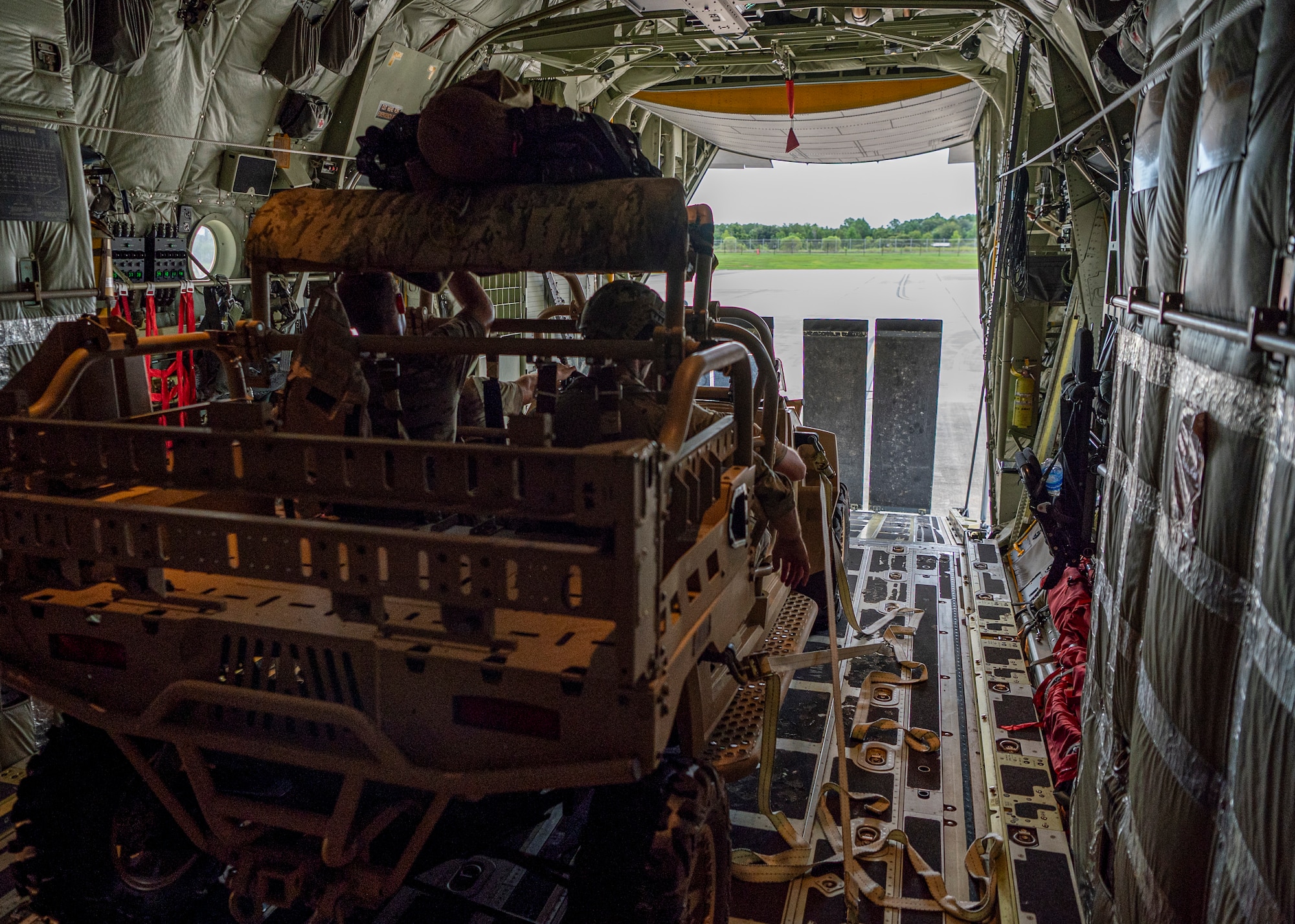 U.S. Air Force Airmen assigned to 38th Rescue Squadron sit in their off-road vehicle inside an HC-130J Combat King II at Moody Air Force Base, Georgia, July 24, 2024. Since 9/11, pararescue men have executed over 12,000 life-saving, combat rescue missions. (U.S. Air Force photo by Senior Airman Leonid Soubbotine)