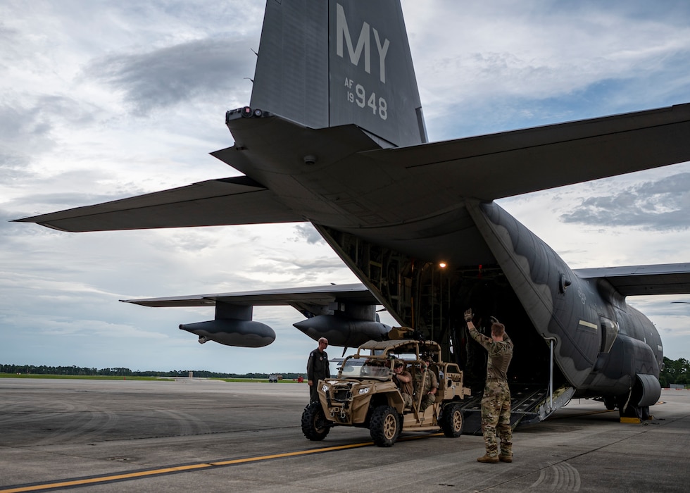 U.S. Air Force Airman 1st Class Eric Peltier, 71st Rescue Squadron loadmaster, guides Airmen assigned to 38th RQS off a ramp of an HC-130J Combat King II at Moody Air Force Base, Georgia, July 24, 2024. Pararescue is highly dedicated to saving lives in the toughest of situations, which is affirmed in their motto “These Things We Do, That Others May Live”. (U.S. Air Force photo by Senior Airman Leonid Soubbotine)