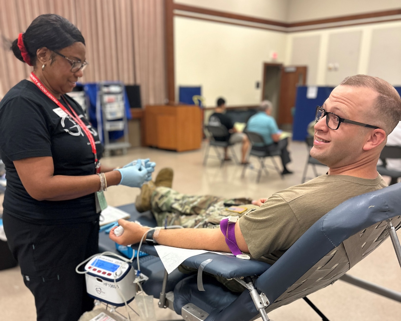 Photo of a nurse drawing from a donor at a blood drive.