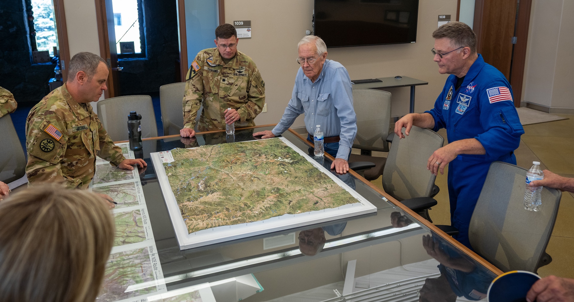 High-Altitude Army National Guard Aviation Training Site instructors and staff brief Charlie Duke, NASA astronaut, before a training flight July 8, 2024, in Gypsum, Colorado. Duke was one of 12 astronauts to walk on the moon during NASA’s Apollo missions. NASA is partnering with HAATS to apply rotary wing skills to lunar landing operations in support of the Artemis mission set.