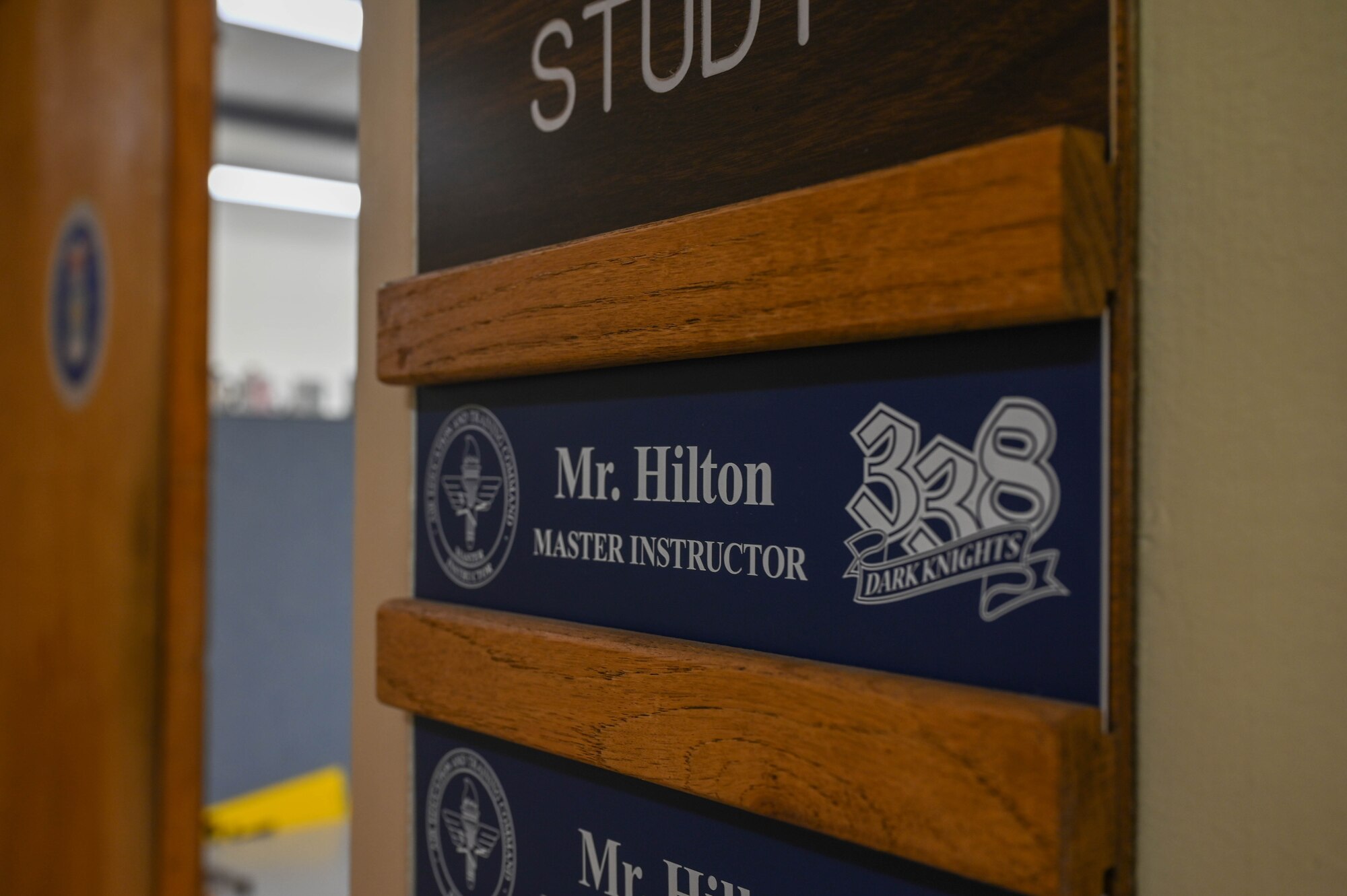 A name plate for Edward Hilton is displayed outside his office on Keesler Air Force Base, Mississippi, July 22, 2024.