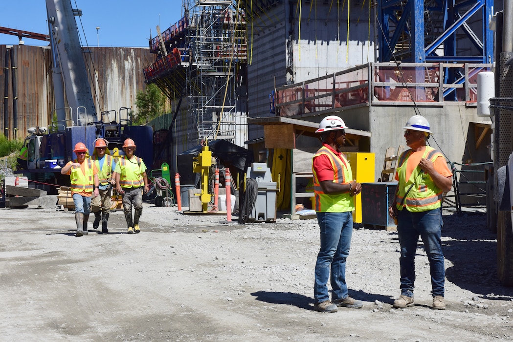 Victor Walker (Second from Right), safety lead for the Kentucky Lock Addition Project on the Tennessee River in Grand Rivers, Kentucky, walks and talks with Thalle Construction employees July 2, 2024. He often interacts with Corps of Engineers employees and contractors to address any safety concerns and to hear suggestions. (USACE Photo by Lee Roberts)