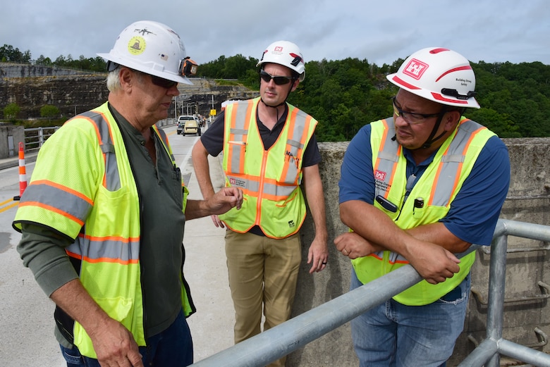 Michael Wilkinson (Right), U.S. Army Corps of Engineers Nashville District’s Construction Support Section senior safety specialist; and Mike Freeman (Center), construction inspector; get a safety brief July 22, 2024, from Eddie Mills, American Bridge Company quality manager, prior to entering a construction area during installation of ladders on Wolf Creek Dam as part of the spillway gates replacement project. (USACE Photo by Lee Roberts)