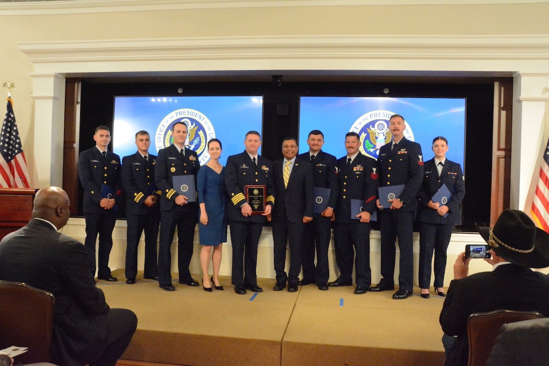 Coast Guard Cutter James (WMSL 754) crew members pose for a group photo with White House Office of National Drug Control Policy Director Dr. Rahul Gupta, center right, July 19, in Washington, D.C. at the White House. James' crew was recognized with the top maritime interdiction during the annual United States Interdiction Coordinator Awards ceremony. (Photo courtesy of the White House)