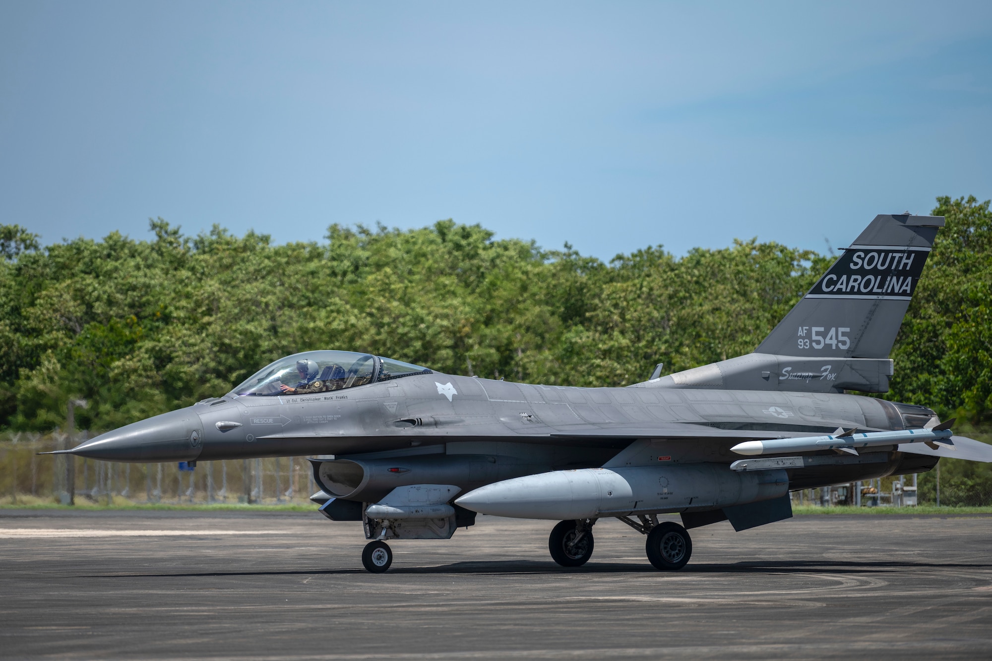 A F-16 Fighting Falcon fighter jet assigned to the 169th Fighter Wing, South Carolina Air National Guard, arrives at the 156th Wing airfield during exercise Caribbean Fox at Muñiz Air National Guard Base, Carolina, Puerto Rico, July 23, 2024. Caribbean Fox is designed to challenge participants in dynamic training scenarios during a two-week period along with offering tailored training for accomplishing critical Agile Combat Employment (ACE) readiness requirements. (U.S. Air National Guard photo by Airman 1st Class Victoria A. Jewett)