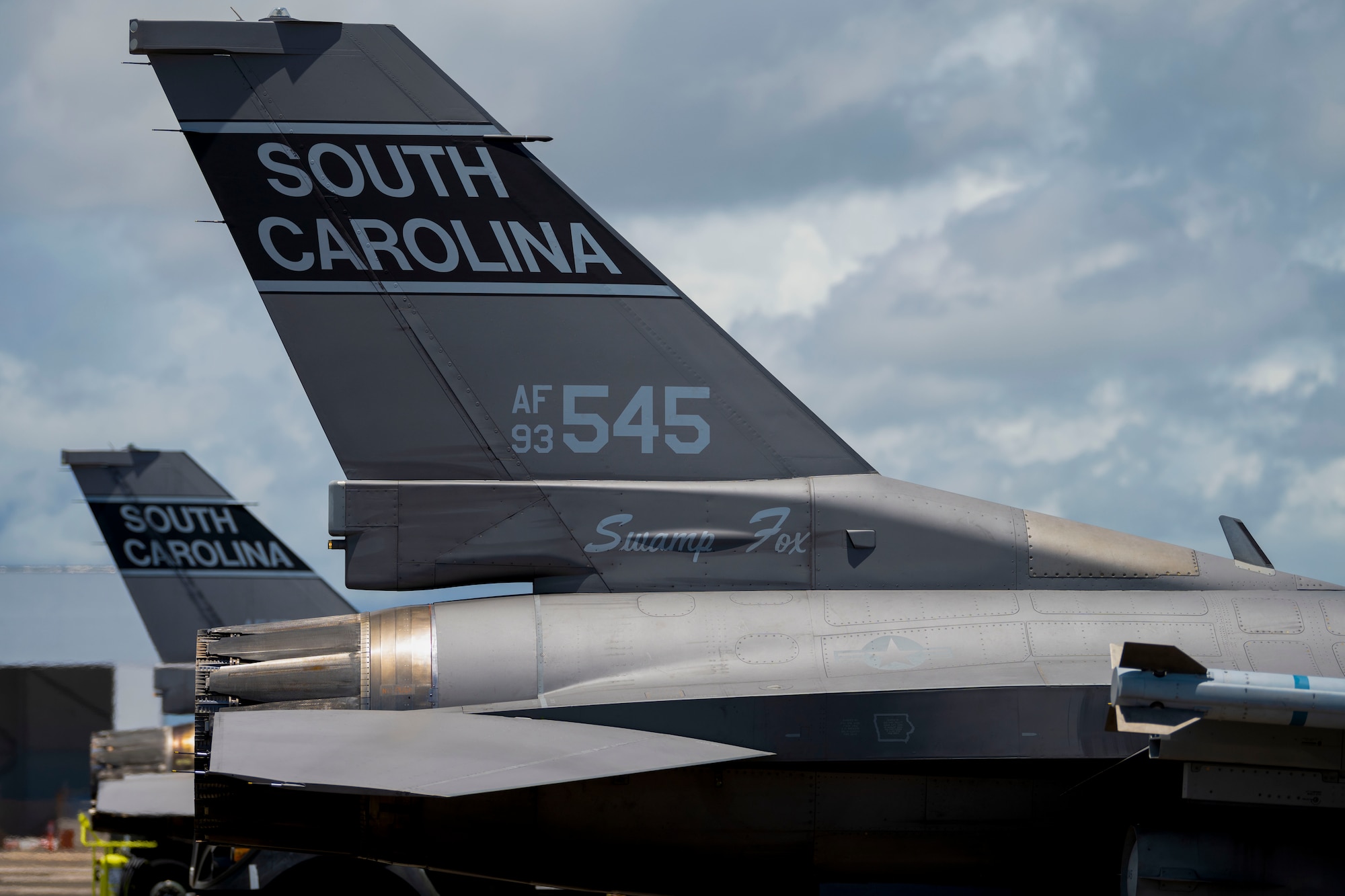 Two F-16 Fighting Falcon fighter jets assigned to the 169th Fighter Wing, South Carolina Air National Guard, arrive at the 156th Wing airfield during exercise Caribbean Fox at Muñiz Air National Guard Base, Carolina, Puerto Rico, July 23, 2024. Caribbean Fox is designed to challenge participants in dynamic training scenarios during a two-week period along with offering tailored training for accomplishing critical Agile Combat Employment (ACE) readiness requirements. (U.S. Air National Guard photo by Airman 1st Class Victoria A. Jewett)