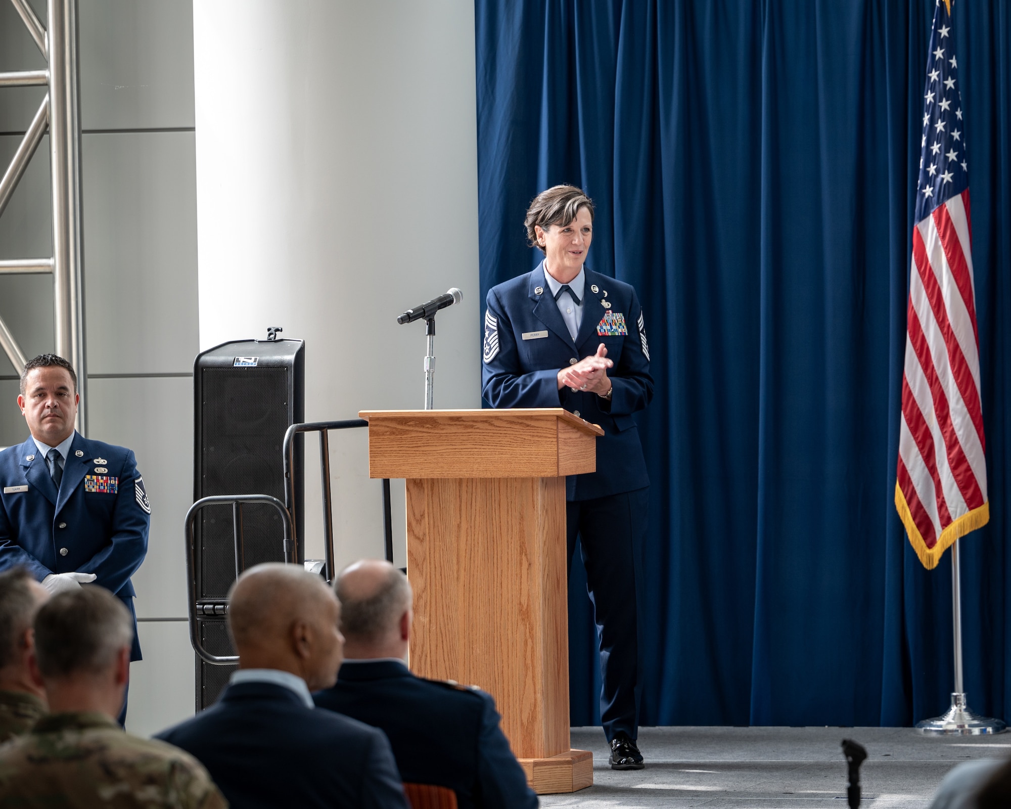 U.S. Air Force Chief Master Sgt. Lisa Perry, interim command chief, Air National Guard delivers remarks during the Outstanding Airmen of the Year ceremony at the Air National Guard Readiness Center, Joint Base Andrews, Maryland, July 26, 2024. The ceremony was part of Focus on the Force Week 2024—an annual, week-long event hosted by Air National Guard senior enlisted leadership designed to highlight professional development and honor the achievements of the enlisted corps’ top performing members. (U.S. Air National Guard photo by Master Sgt. Brandy Fowler)