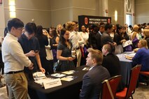 Montgomery County Public Schools’ Summer RISE Program interns chat with the Carderock’s table at the program career fair session at the Bethesda North Marriott Hotel and Conference Center in Rockville, Md., July 25, 2024.