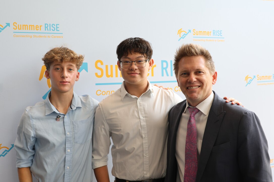 Carderock’s Branch Head of Public Affairs and Congressional Affairs, Ian McConnaughey (right), poses with Montgomery County Public Schools’ Summer RISE Program interns, Daniel T. (left), and Hiep N. (center), who worked in the Corporate Communications Department, at the program’s closing ceremony at the Bethesda North Marriott Hotel and Conference Center in Rockville, Md., July 25, 2024.