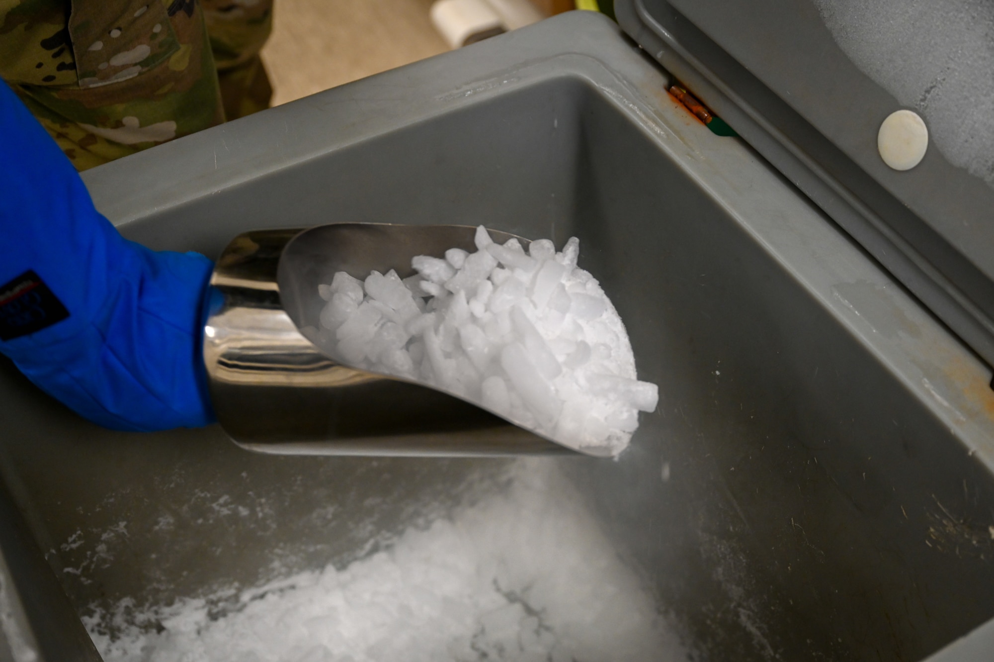 Airman collecting dry ice.