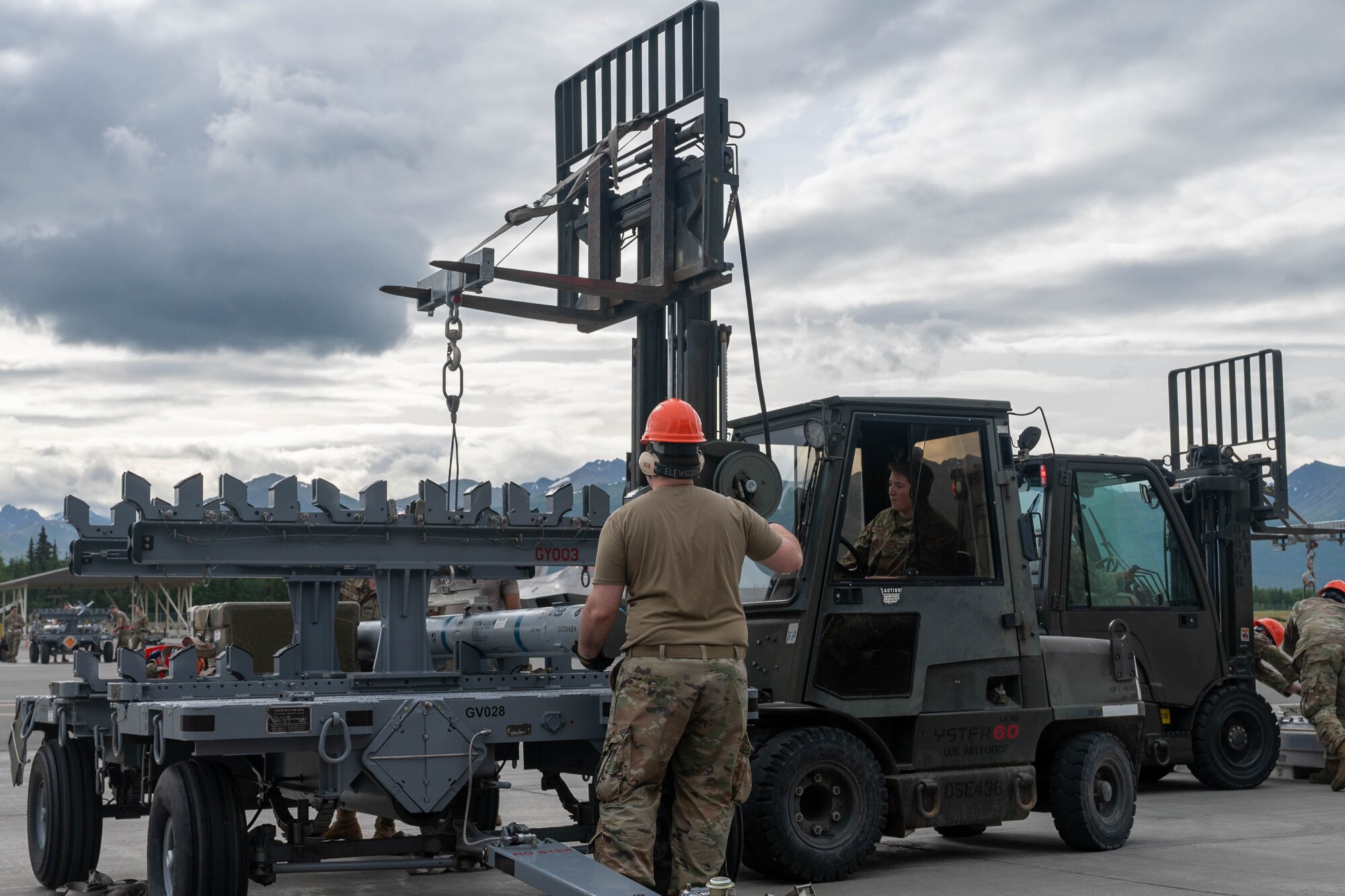 On July 12, 2024, spectators witnessed Joint Base Elmendorf-Richardson’s first live regeneration-style competition. Ammo crews prepared world-class munitions, crew chiefs quick-turned four F-22 raptors, and four weapons load crews threw down in a head-to-head weapons load competition.