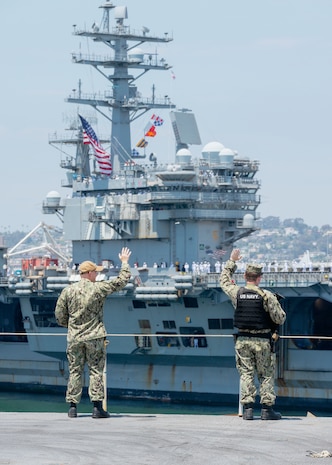 Nimitz-class aircraft carrier USS Ronald Reagan (CVN 76) mans the rails while mooring on Naval Air Station North Island, San Diego July 23, 2024.