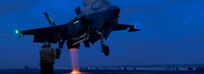 U.S. Marine Corps F-35B Lightning II aircraft assigned to Marine Fighter Attack Squadron (VMFA) 121, 31st Marine Expeditionary Unit, prepares to land during night flight operations aboard the amphibious assault ship USS America (LHA 6) on July 25, 2024.