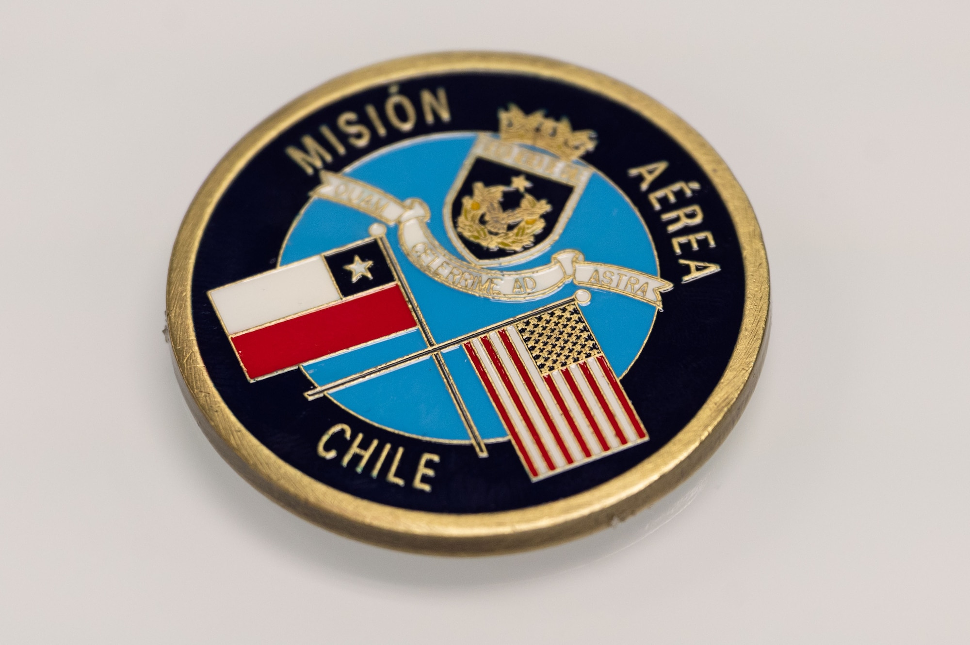 A coin from Chilean Air Force Col. Dabor Arbunic sits on a table at Dover Air Force Base, Delaware, July 17th, 2024. The visit was part of a multi-day Foreign Military Sales mission between the United States and Chile. Chile is one of the United States’ strongest partners in Latin America and a leader in promoting respect for the rule of law, economic stability, education, environmental protection, human rights, and sustainable development. (U.S. Air Force photo by Senior Airman Dieondiere Jefferies)