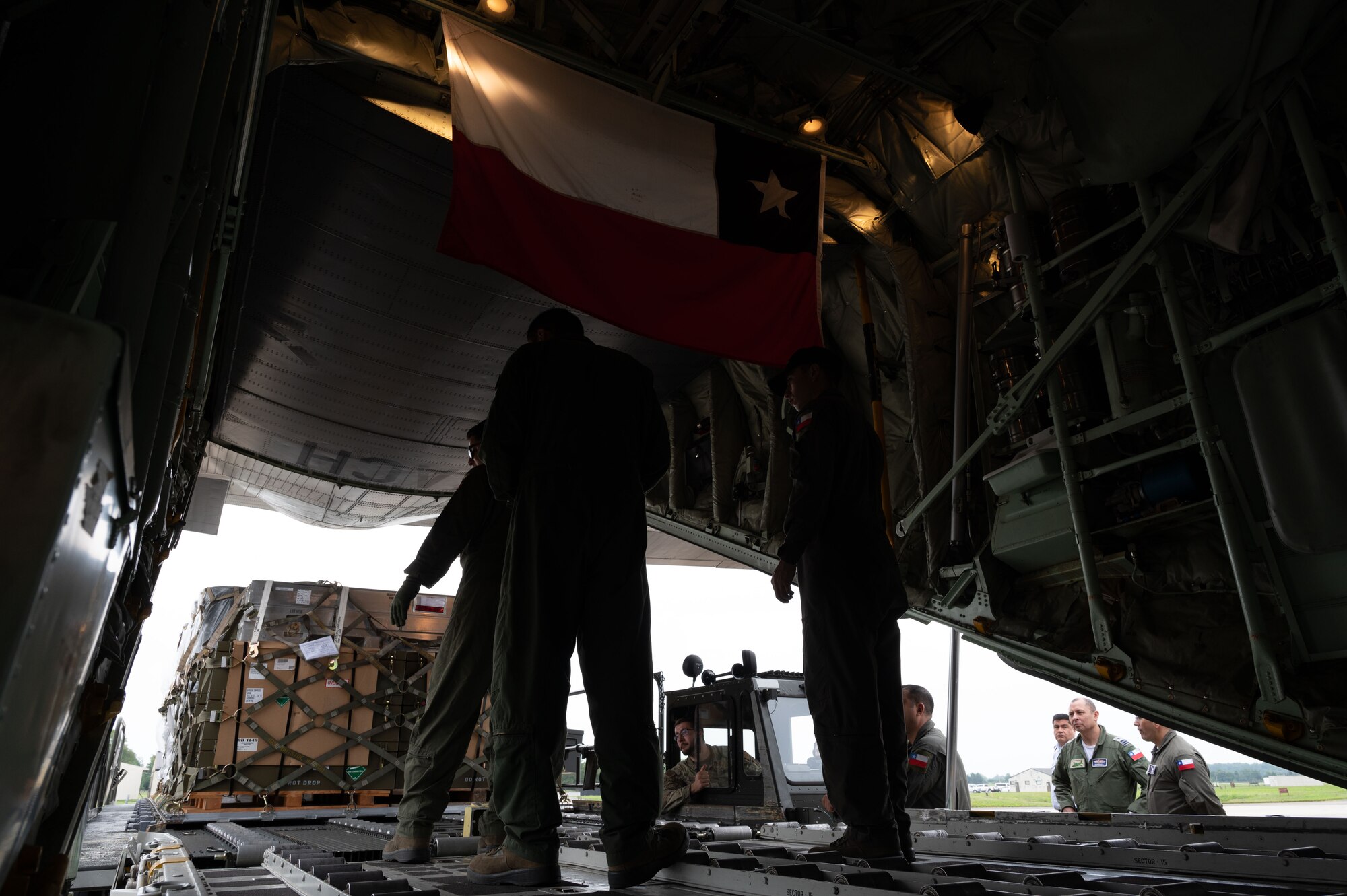 Members of the Chilean Air Force load a C-130 Hercules at Dover Air Force Base, Delaware, July 23, 2024. The visit was part of a multi-day Foreign Military Sales mission between the United States and Chile. Chile is one of the United States’ strongest partners in Latin America and a leader in promoting respect for the rule of law, economic stability, education, environmental protection, human rights, and sustainable development. (U.S. Air Force photo by Senior Airman Dieondiere Jefferies)