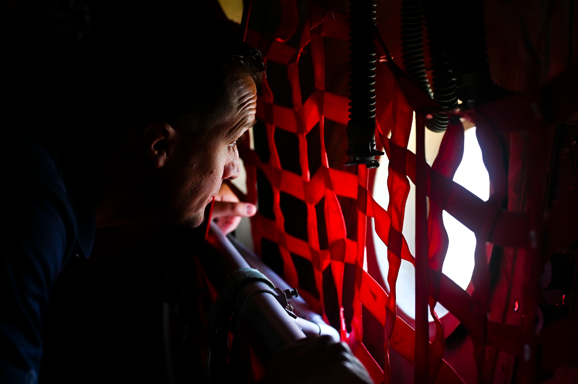 Kylon Atteberry, Goodfellow Air Force Base honorary commander, looks out of the window of a C-130J Super Hercules aircraft during an incentive flight at Dyess Air Force Base, Texas, July 24, 2024. The 317th Airlift Wing flew Goodfellow’s honorary commanders on a C-130J Super Hercules, giving them a taste of one of the operational Air Force missions the 17th Training Wing supports. (Airman 1st Class Madison Collier)