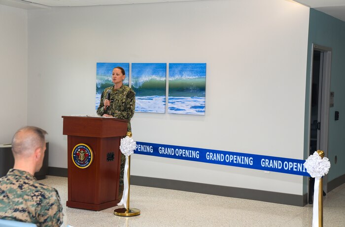 Capt. Anja Dabelic, Naval Medical Center Camp Lejeune commander, makes opening remarks during the grand opening ceremony of the Marine Centered Medical Home (MCMH) New River clinic aboard Marine Corps Air Station New River on July 26, 2024. MCMH New River provides routine appointments/physicals and specialty services to active-duty personnel aboard MCAS New River.