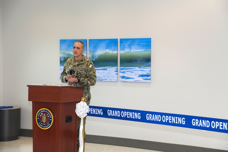 Rear Admiral Kevin Brown, Naval Medical Forces Atlantic commander and Defense Health Network Atlantic directors, makes his guest speaker remarks during the grand opening ceremony of the Marine Centered Medical Home (MCMH) New River clinic aboard Marine Corps Air Station New River on July 26, 2024. MCMH New River provides routine appointments/physicals and specialty services to active-duty personnel aboard Marine Corps Air Station New River.