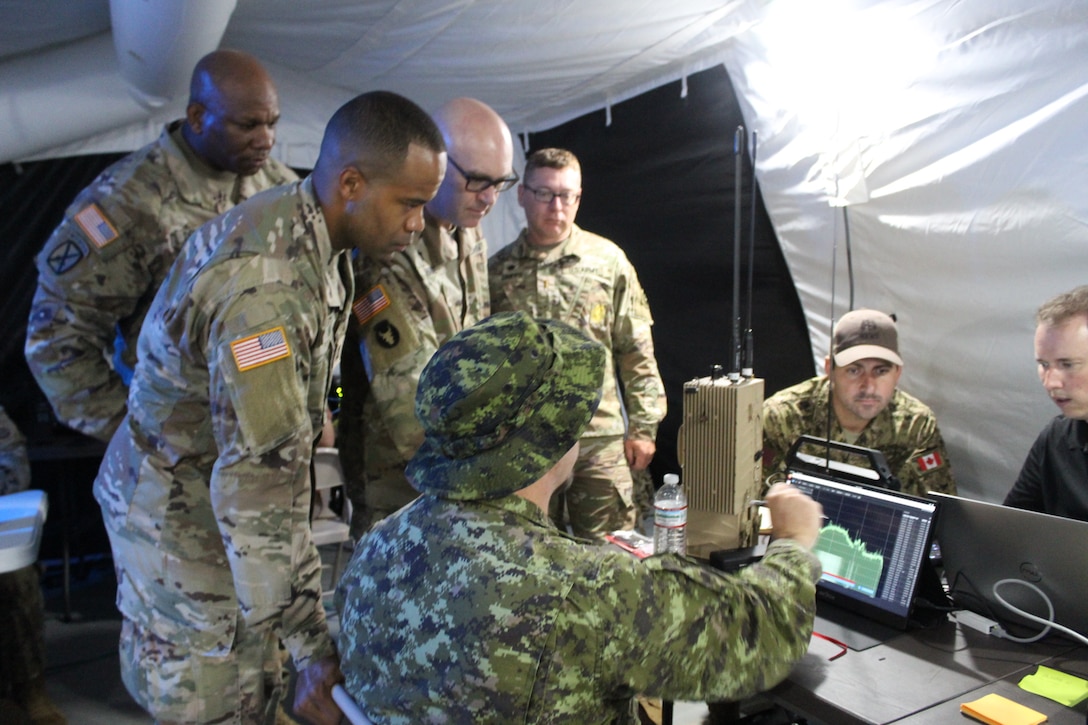 Soldiers from the U.S. Army, the 75th U.S. Army Reserve Innovation Command, and various nations gathered to gain information during Cyber Quest 24 on July 17, 2024, at Fort Eisenhower, Ga. Cyber Quest 24 brought together Soldiers, industry partners, and government agencies to evaluate cutting-edge technologies that will shape the future battlefield. (U.S. Army photo by Lesli Ellis-Wouters)