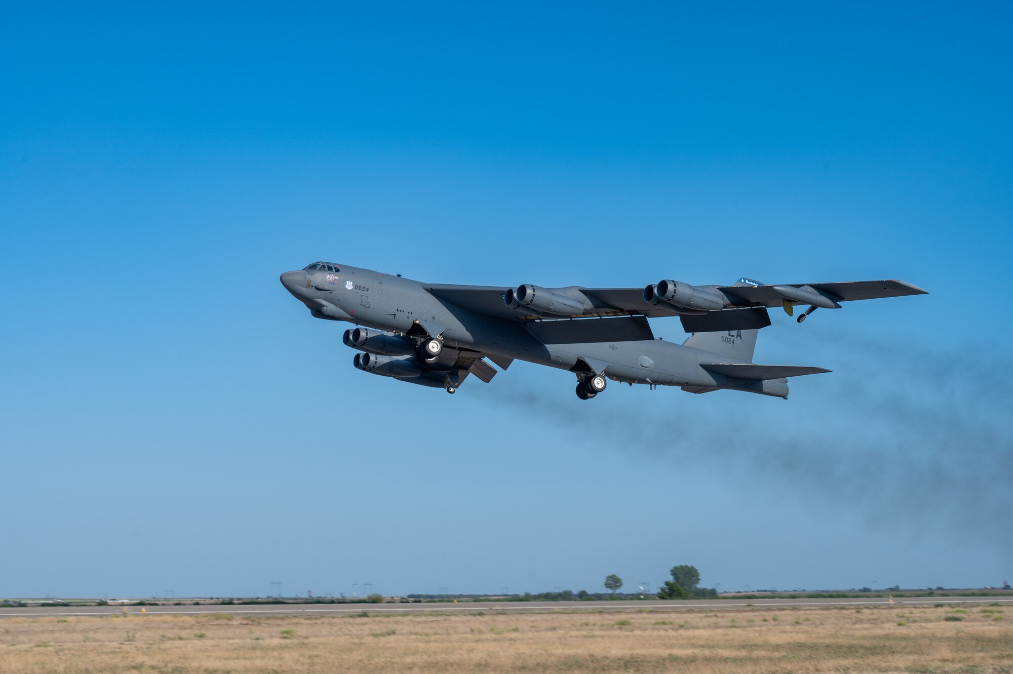 A B-52H Stratofortress from the 20th Bomb Squadron, Barksdale Air Force Base, La., takes off from Mihail Kogălniceanu Air Base, Romania, as part of Bomber Task Force Deployment 24-4, July 27, 2024. BTF 24-4 is a demonstration of cooperation, collaboration, interoperability, and solidarity to promote peace and security. (U.S. Air Force photo by Senior Airman Seth Watson)