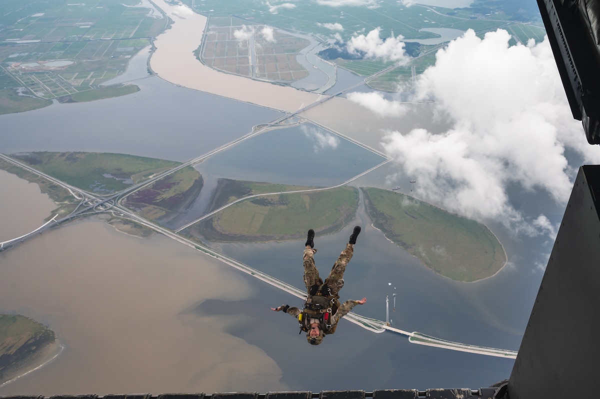 An Airman assigned to the 320th Special Tactics Squadron, conducts a military freefall jump out of an MC-130J Commando II assigned to the 1st Special Operations Squadron over Kunsan Air Base, Republic of Korea.
