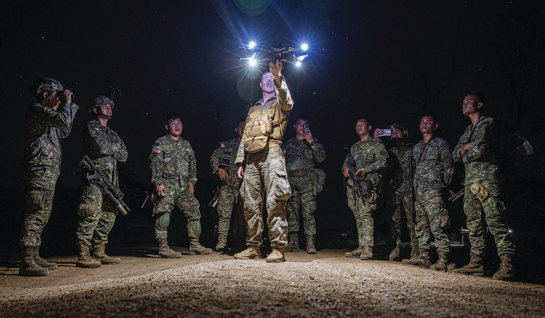 U.S. Marine Corps Corporal Joshua Henneberg, rifleman assigned to Alpha Company, Battalion Landing Team 1/5, 15th Marine Expeditionary Unit, prepares to launch Skydio X2D small unmanned aerial system during integrated training alongside Philippine marines during exercise Balikatan 24 on Balabac Island