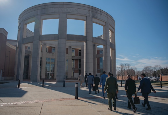 College of International Security Affairs Class of 2023 students walk into Abraham Lincoln Hall, National Defense University, February 1, 2023.