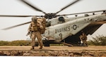 Marines assigned to Charlie Company, Battalion Landing Team 1/5, 15th Marine Expeditionary Unit, exit CH-53E Super Stallion attached to
Marine Medium Tiltrotor Squadron 165 (Reinforced), 15th MEU, for amphibious landing during exercise Tiger Triumph at Kakinada Beach, India.