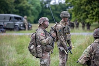 (From left) 2nd Lt. Margaret Dean, Charlie Company, 3rd Battalion, 172nd Infantry Regiment (Mountain), 54th Troop Command, New Hampshire Army National Guard, stands by her radio operator, 2nd Lt. Taylor Grundy, platoon signaller, 4th Battalion