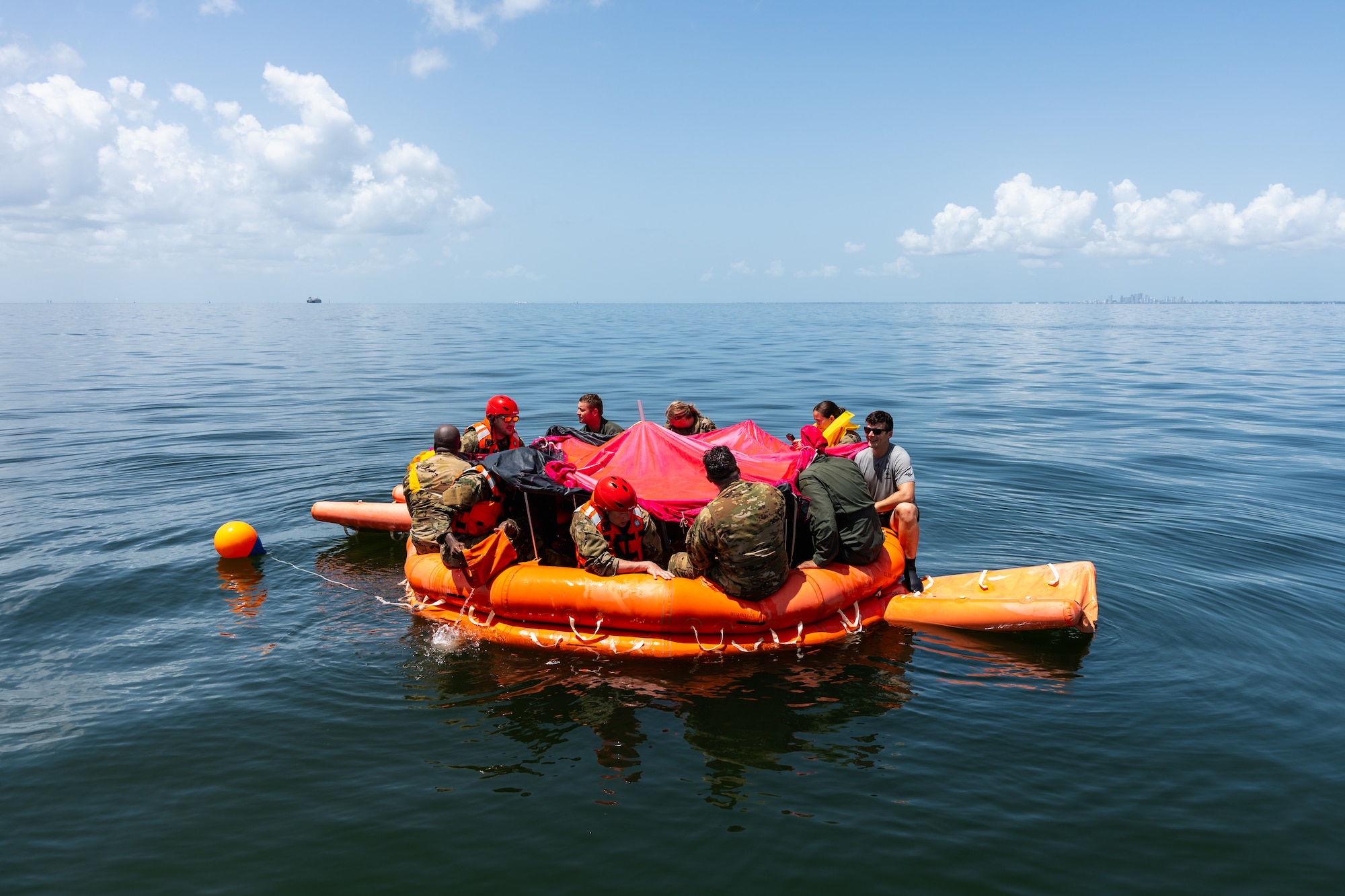 U.S. Air Force aircrew members participate in a water survival training exercise near MacDill Air Force Base, Florida, July 22, 2024. The training exercise was part of the Air Force’s Survival, Evasion, Resistance and Escape curriculum designed to prepare Airmen for escaping a downed aircraft in open water. (U.S. Air Force photo by Senior Airman Joshua Hastings)