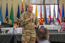 Photo of Col Crocker addressing the summit attendees