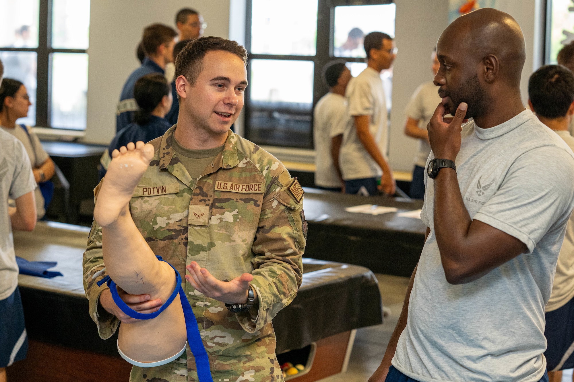 An 81st Medical Group Airman explains the importance of proper tourniquet placement at the Student Health Fair on Keesler Air Force Base, Mississippi, July 19, 2024.