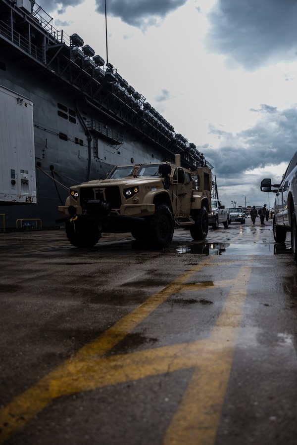 A U.S. Marine with Combat Logistics Battalion 22, Combat Logistics Regiment 2, 2nd Marine Logistics Group, drives a joint light tactical vehicle during Defense Support of Civil Authorities mission rehearsals at Naval Base Norfolk, Virginia, July 22, 2024. Marines and Sailors with the II Marine Expeditionary Force (II MEF) Maritime DSCA Task Force conducted a full mission rehearsal in order to practice deploying as a team in support of civil authorities. This rehearsal was designed by II MEF and United States Fleet Forces Command to integrate and increase amphibious capabilities on the East Coast for potential humanitarian relief and disaster assistance mission during this hurricane season. (U.S. Marine Corps photo by Cpl. Meshaq Hylton)