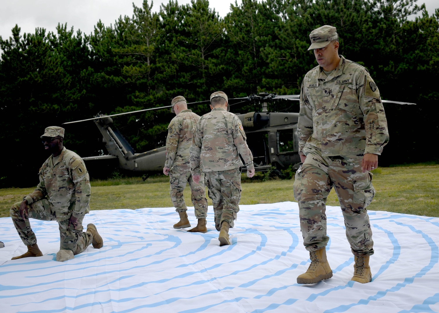 Soldiers in recovery from Fort Drum SRU walk a labyrinth maze.