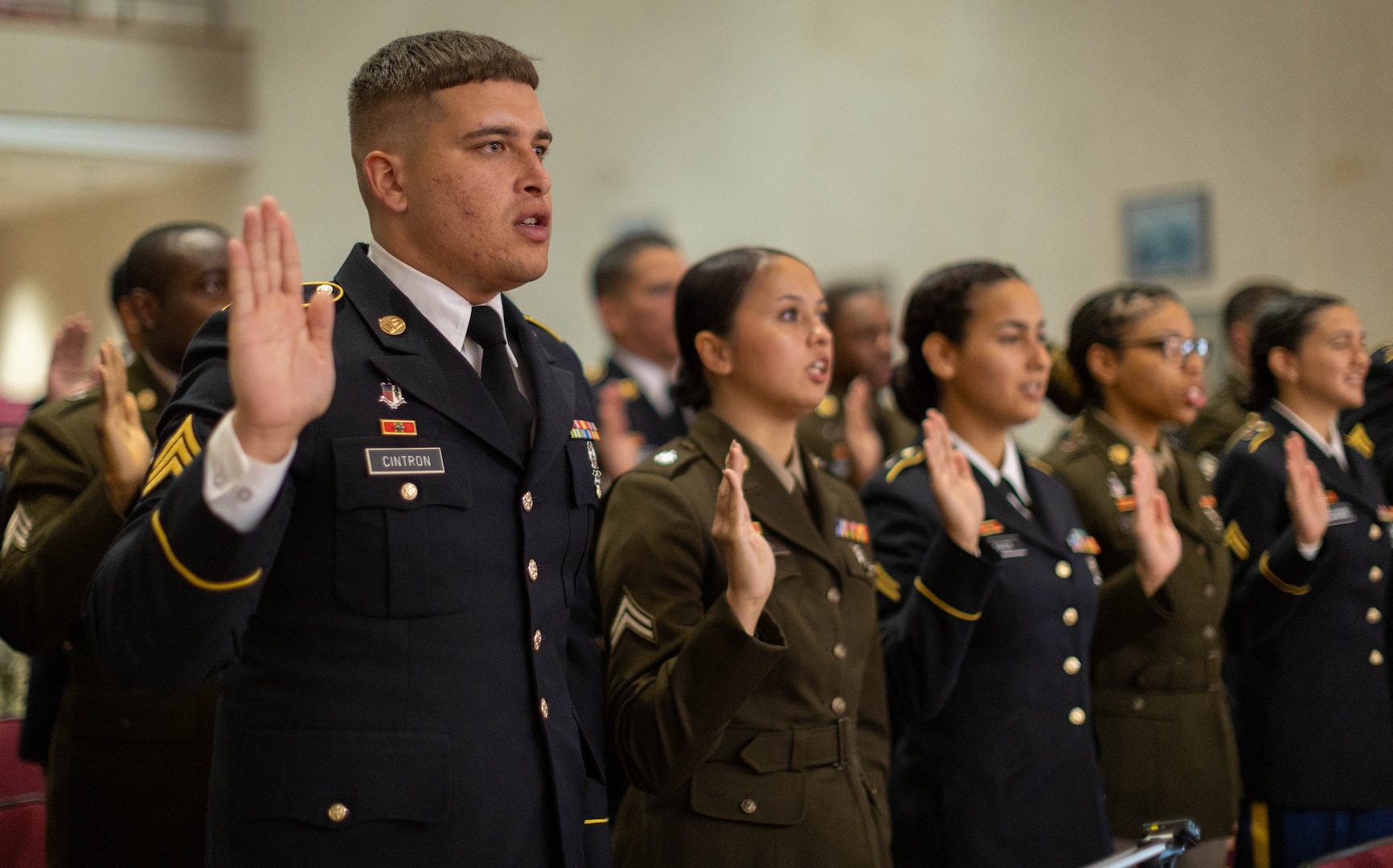 Twenty Soldiers take the Noncommissioned Officer (NCO) Charge during an NCO Induction Ceremony in Memorial Auditorium at Walter Reed National Military Medical Center July 24, 2024.