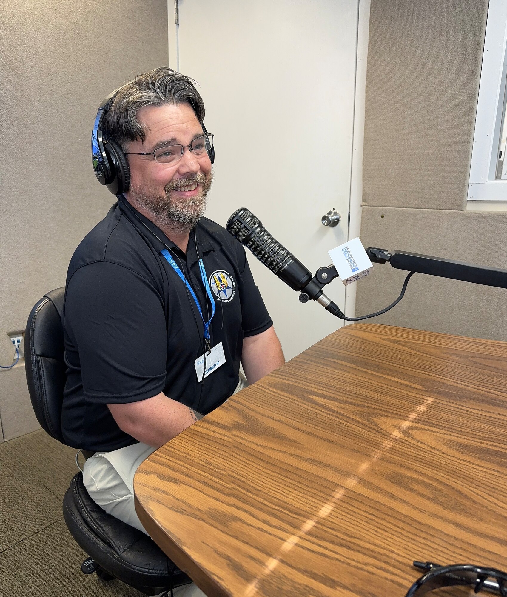 Air Force Sustainment Center STEM Program Outreach Manager Clif Harden speaks with Digital Dan and Fast Eddy during their morning radio show Hot Start inside the EAA Radio studio in Oshkosh, Wi., July 26.