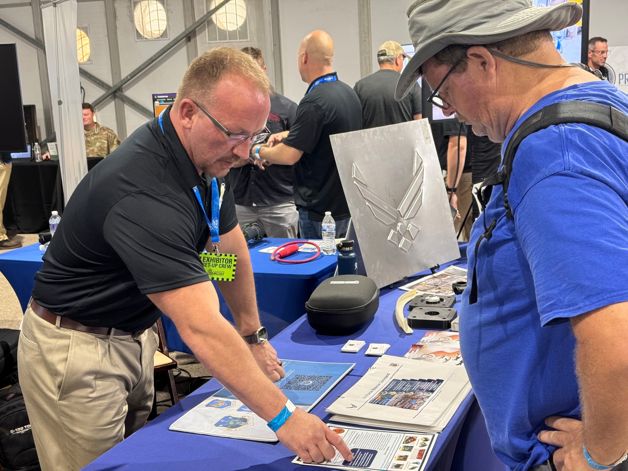 hawn Hattaway, a strategic planner for Warner Robins Air Logistics Complex, explains the mission of what his organization does to visitors during the Experimental Aircraft Association’s AirVenture Oshkosh 2024 airshow in Oshkosh, Wi., July 23.