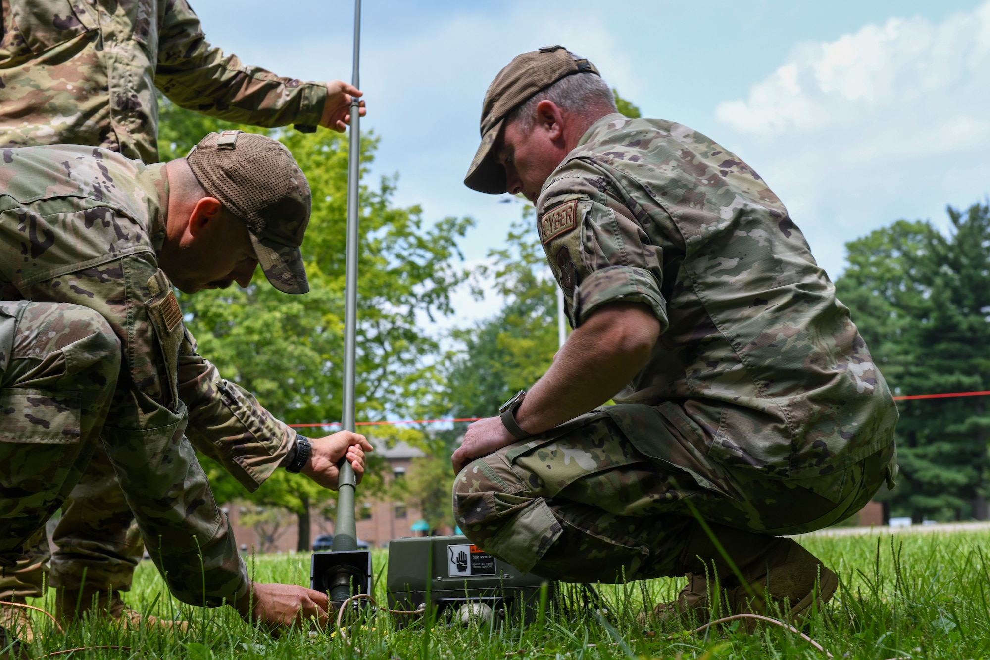Master Sgt. Gilbert Martin and Tech. Sgt. Joshua Powell, 910th Communications Squadron citizen Airmen, ready a communications device during the U.S. Army Networks Command High-Frequency Skills Competition at Youngstown Air Reserve Station, Ohio, July 25, 2024.